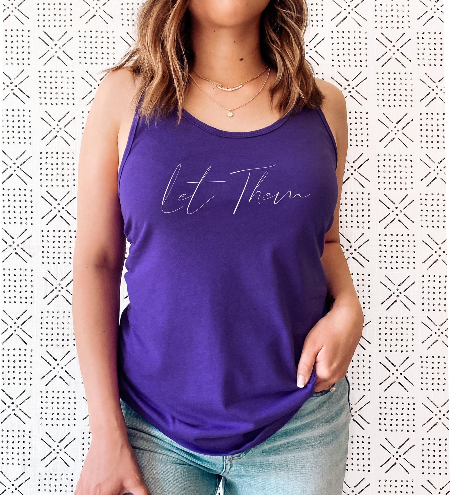 Let Them tank top close-up showing soft fabric and graphic print detail in purple