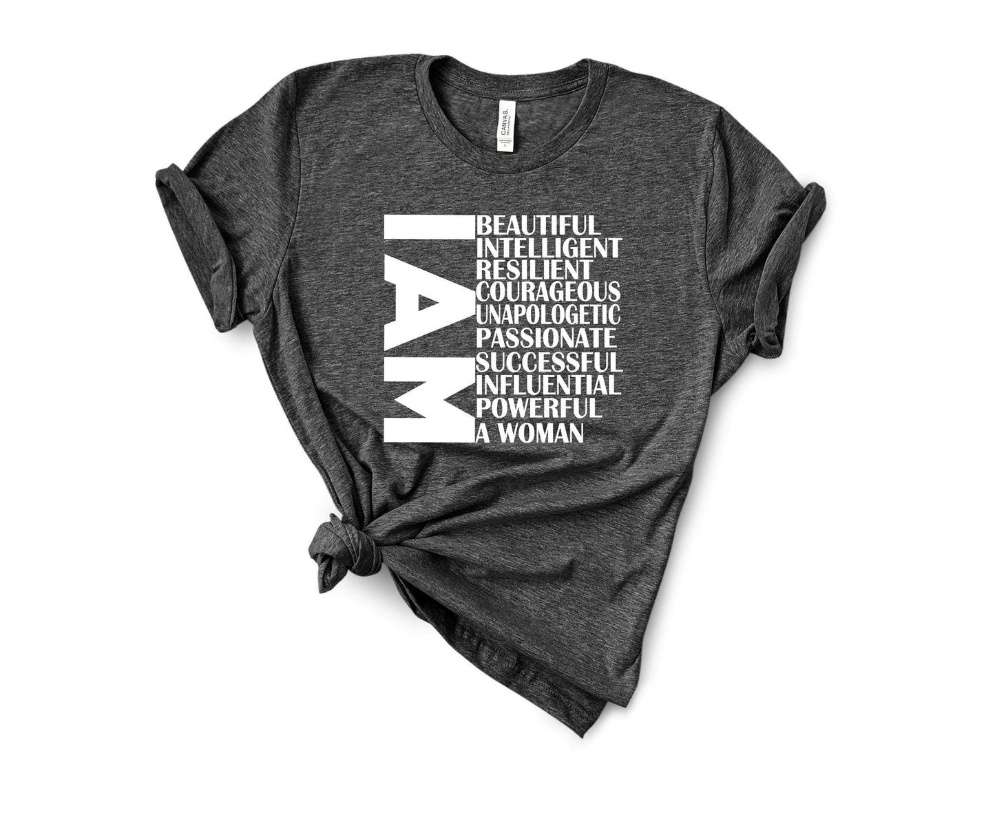 I AM A WOMAN t-shirt close-up showing soft fabric and bold graphic detail in dark grey