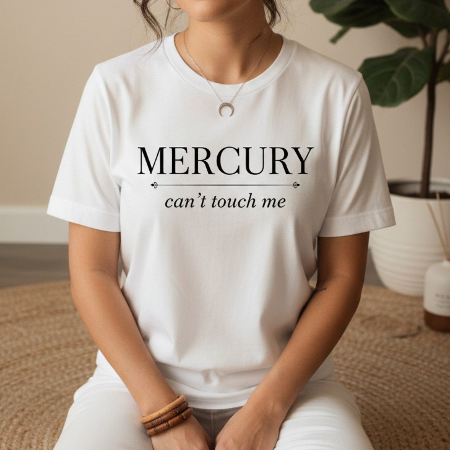 White Mercury Can't Touch Me t-shirt with black serif and script print — clean minimal astrology tee for the spiritual woman who keeps her energy high all retrograde long