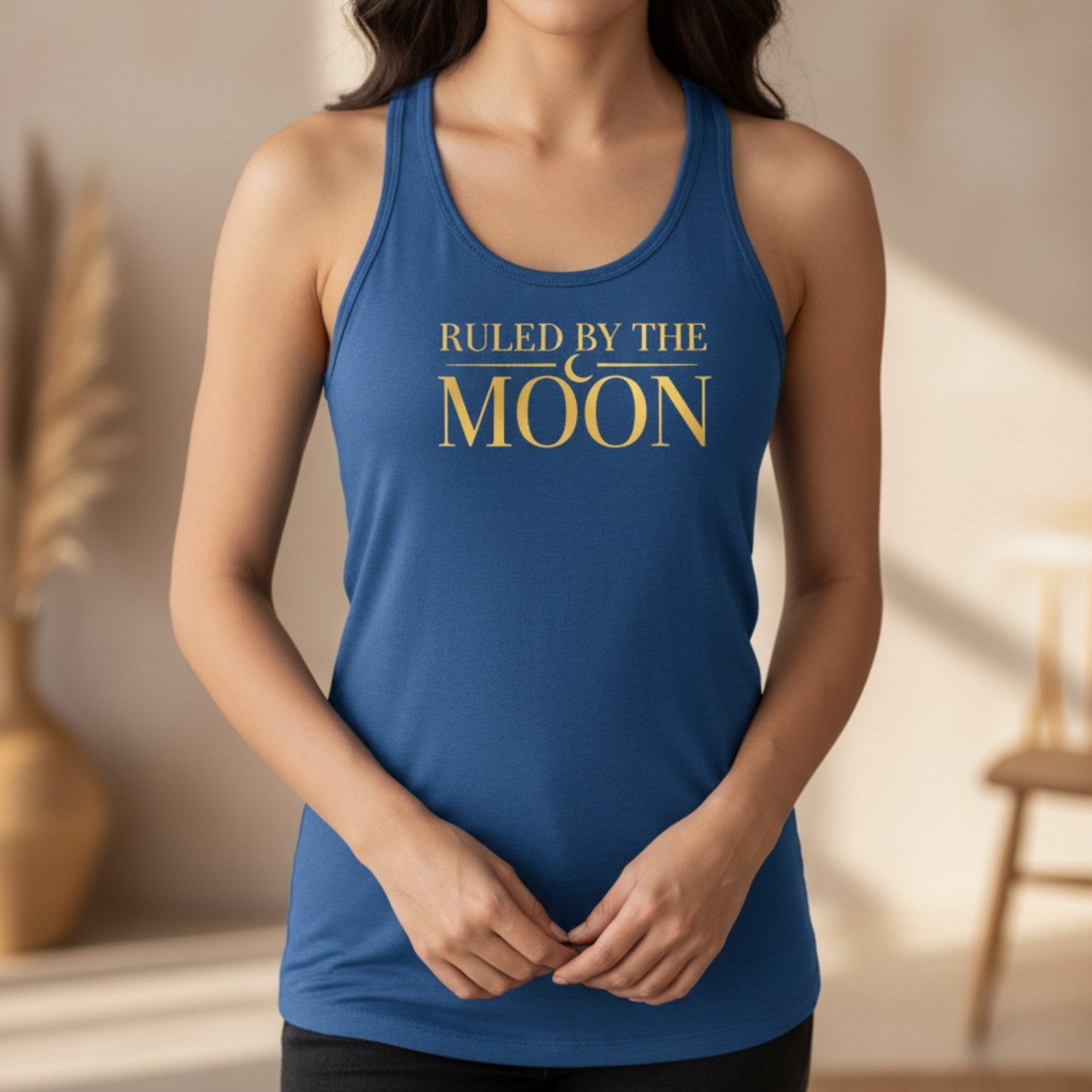 Blue Ruled By The Moon racerback tank top with gold moon typography — celestial astrology gift for her, heat-pressed in Canada