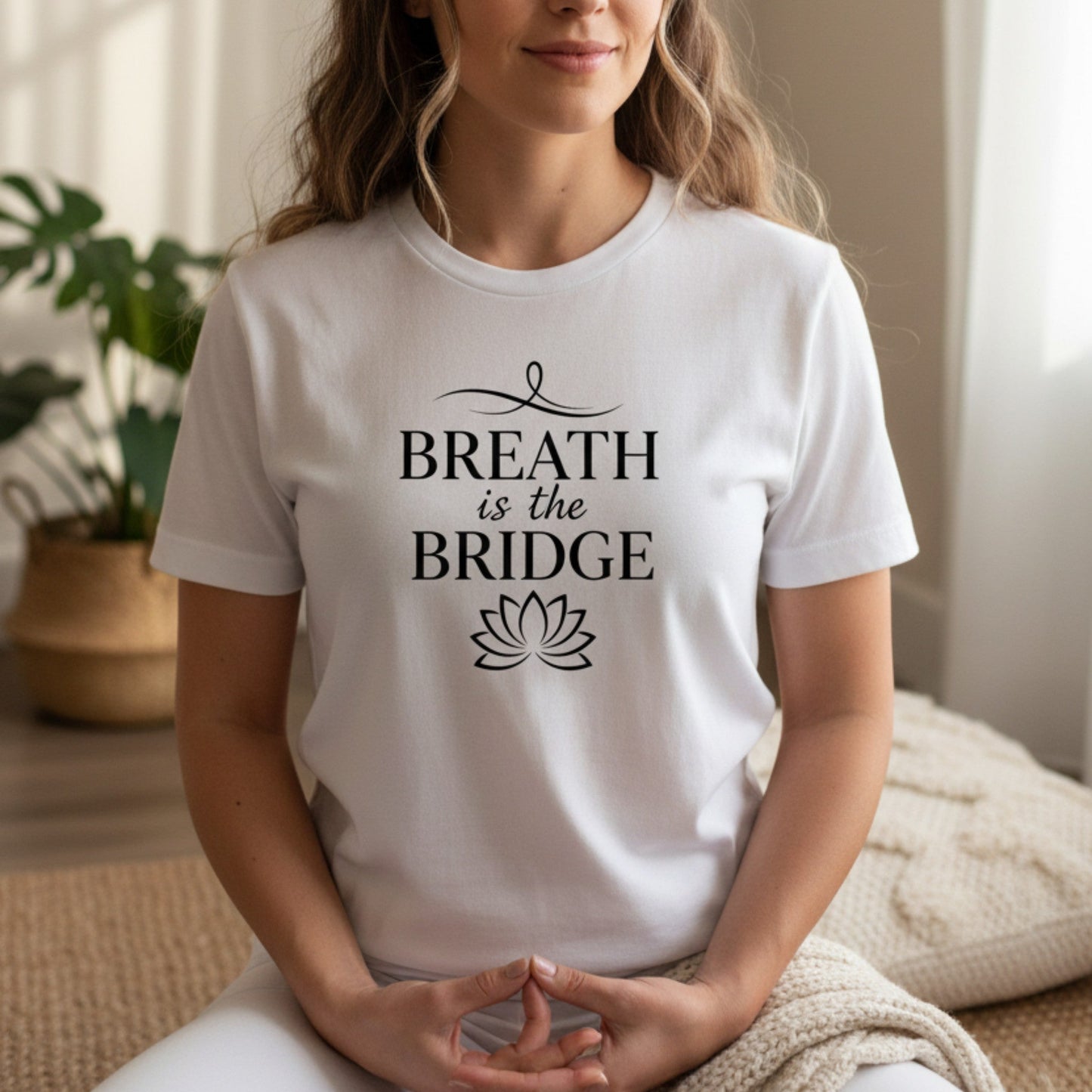 White Breath Is The Bridge graphic tee with black serif caps and lotus detail — clean minimal mindfulness gift for the woman who breathes her way back to herself every single day