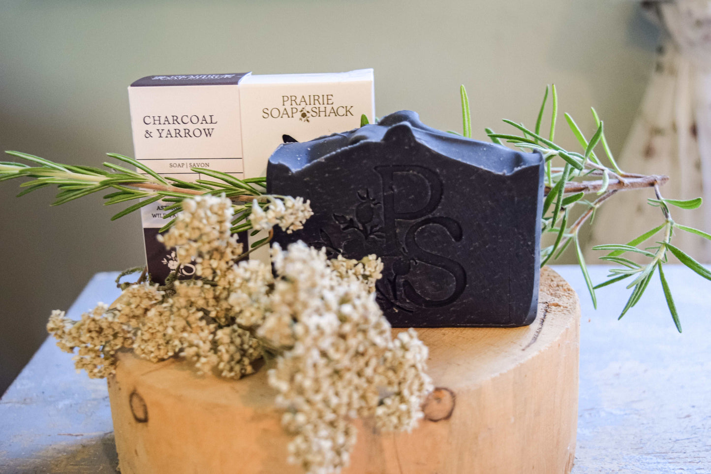 Natural activated charcoal artisan soap close-up showing handcrafted detail