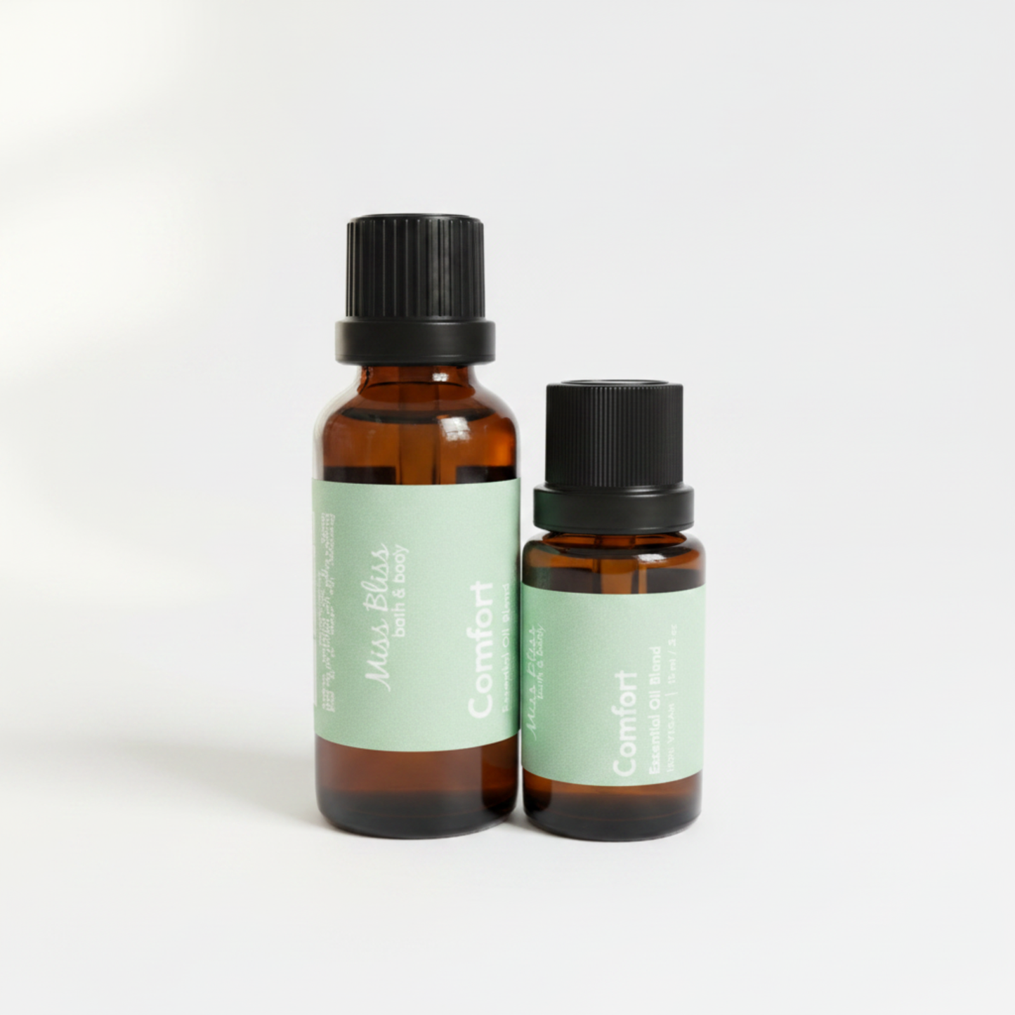 Comfort Essential Oil Blend — 30ml and 15ml amber glass bottles with green labels, 100% pure essential oils, handcrafted in Canada
