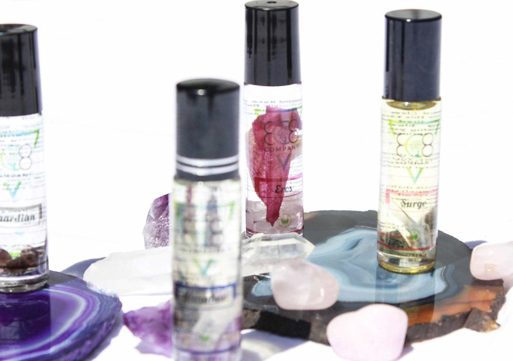 Gemstone rollers kit close-up showing crystal roller bottles and packaging detail