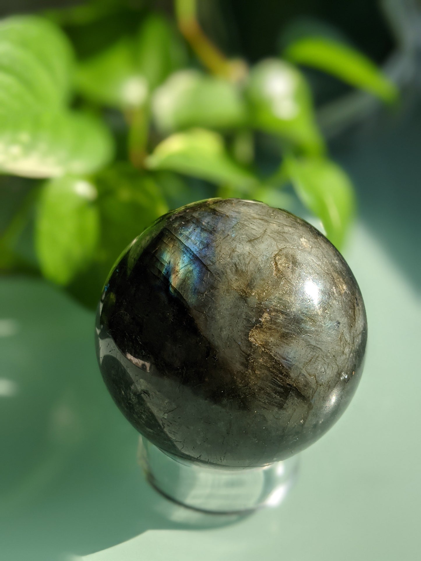 Mystical and transformation-enhancing labradorite sphere with iridescent flash
