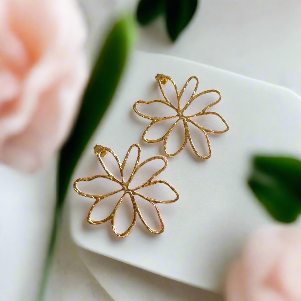 Open flower stud earrings boho floral artisan jewelry handmade in Bali on white surface