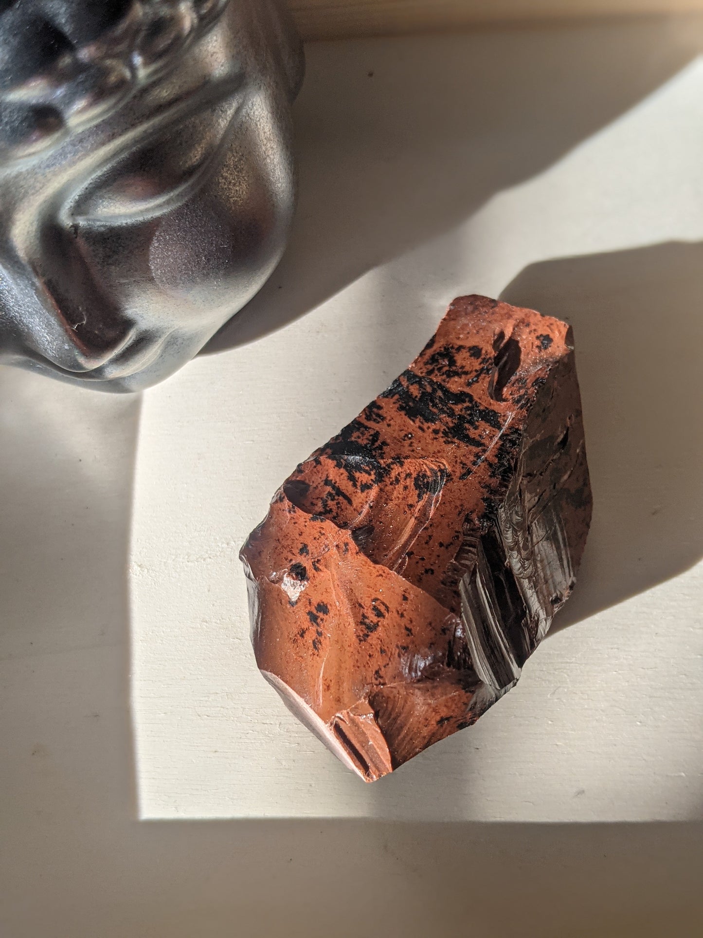 Raw mahogany obsidian chunk for root chakra healing and energetic grounding