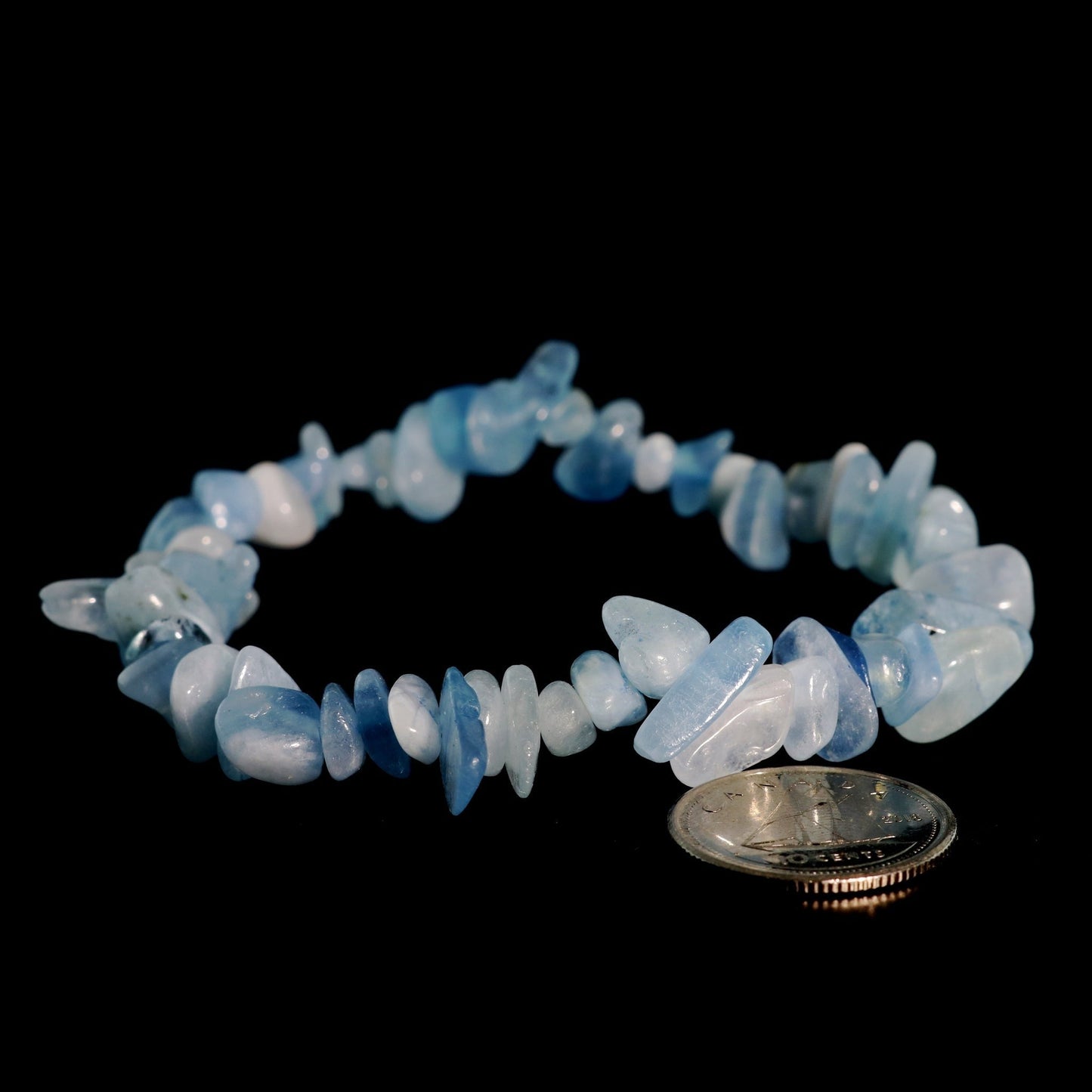 Soft blue aquamarine crystal bracelet worn on wrist for calming energy