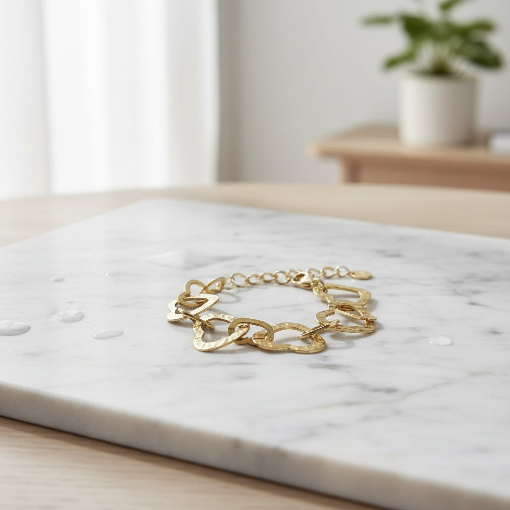 Handmade gold heart link bracelet boho romantic style on table