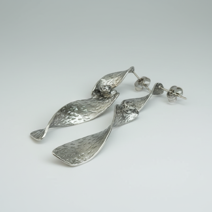 Silver stainless steel beaten metal twist earrings side view handcrafted jewelry