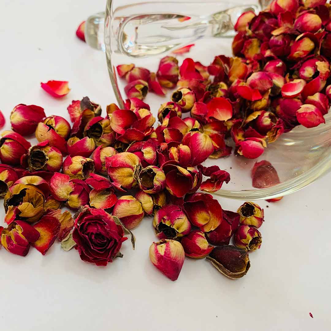 Close-up of whole dried red rose buds — fragrant loose flower tea by Rayhana Organics