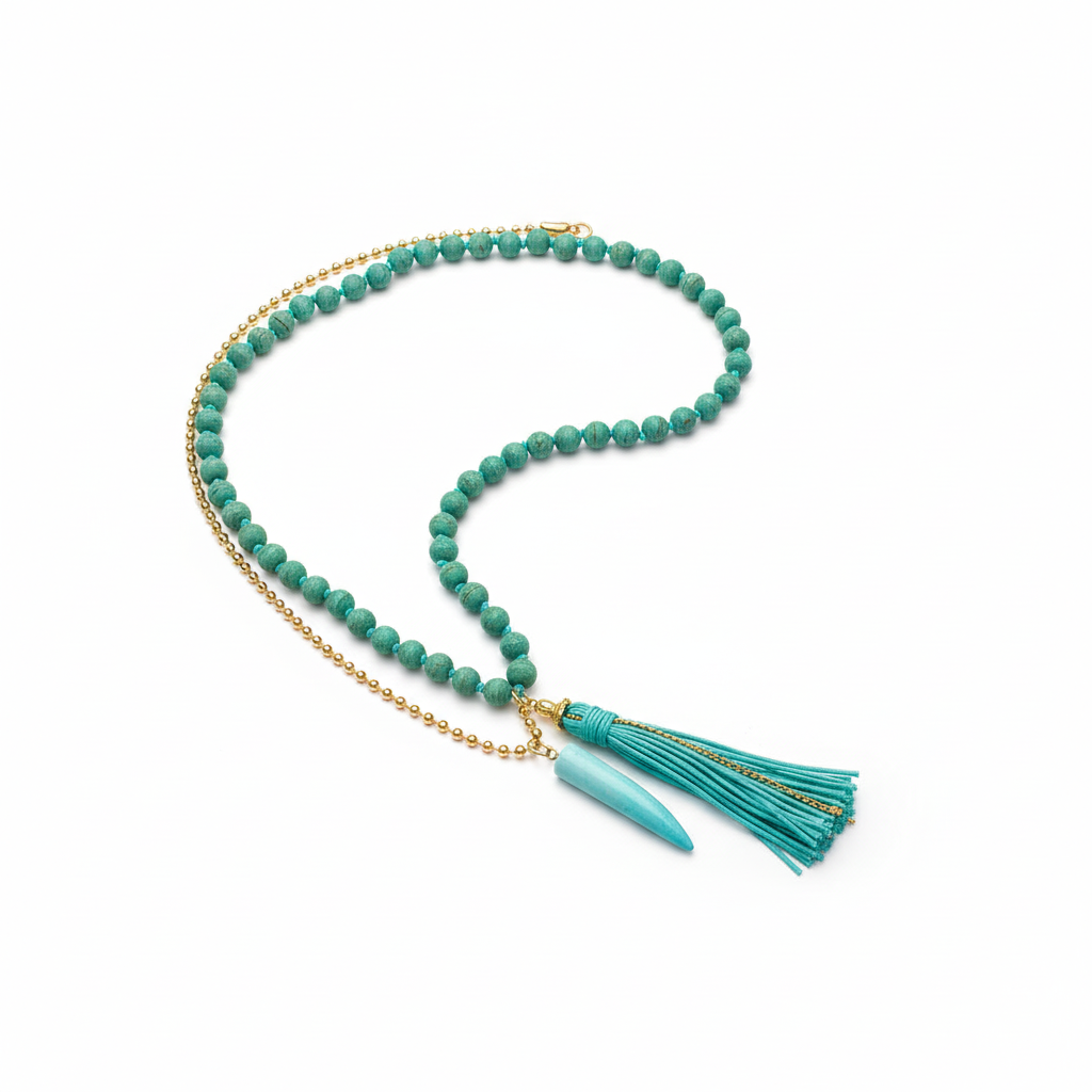 Handcrafted turquoise tooth mala necklace draped on white background — natural beads with turquoise accent for meditation, yoga, and spiritual wear