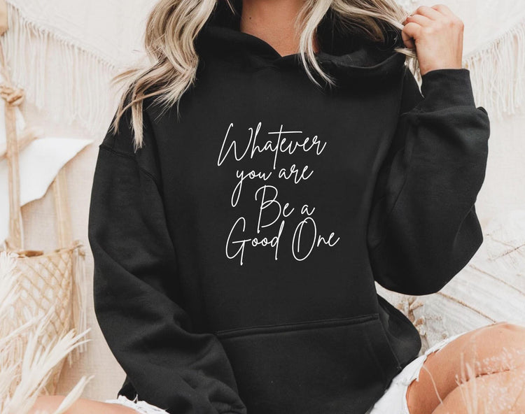 Woman wearing motivational graphic hoodie with inspiring quote