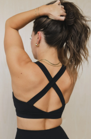 Women's black cross-back sports bra with criss-cross strap detail — supportive yoga bras and sports bras for workouts and active wear