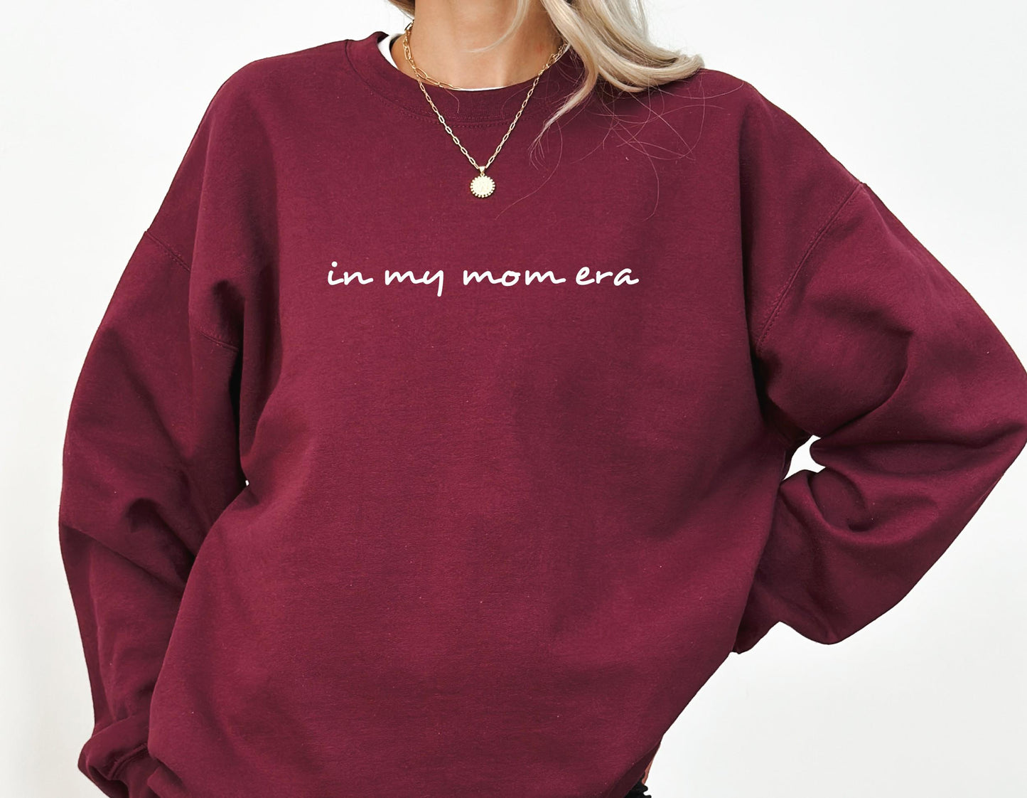 In My Mom Era sweatshirt close-up showing soft fabric and graphic print detail in maroon