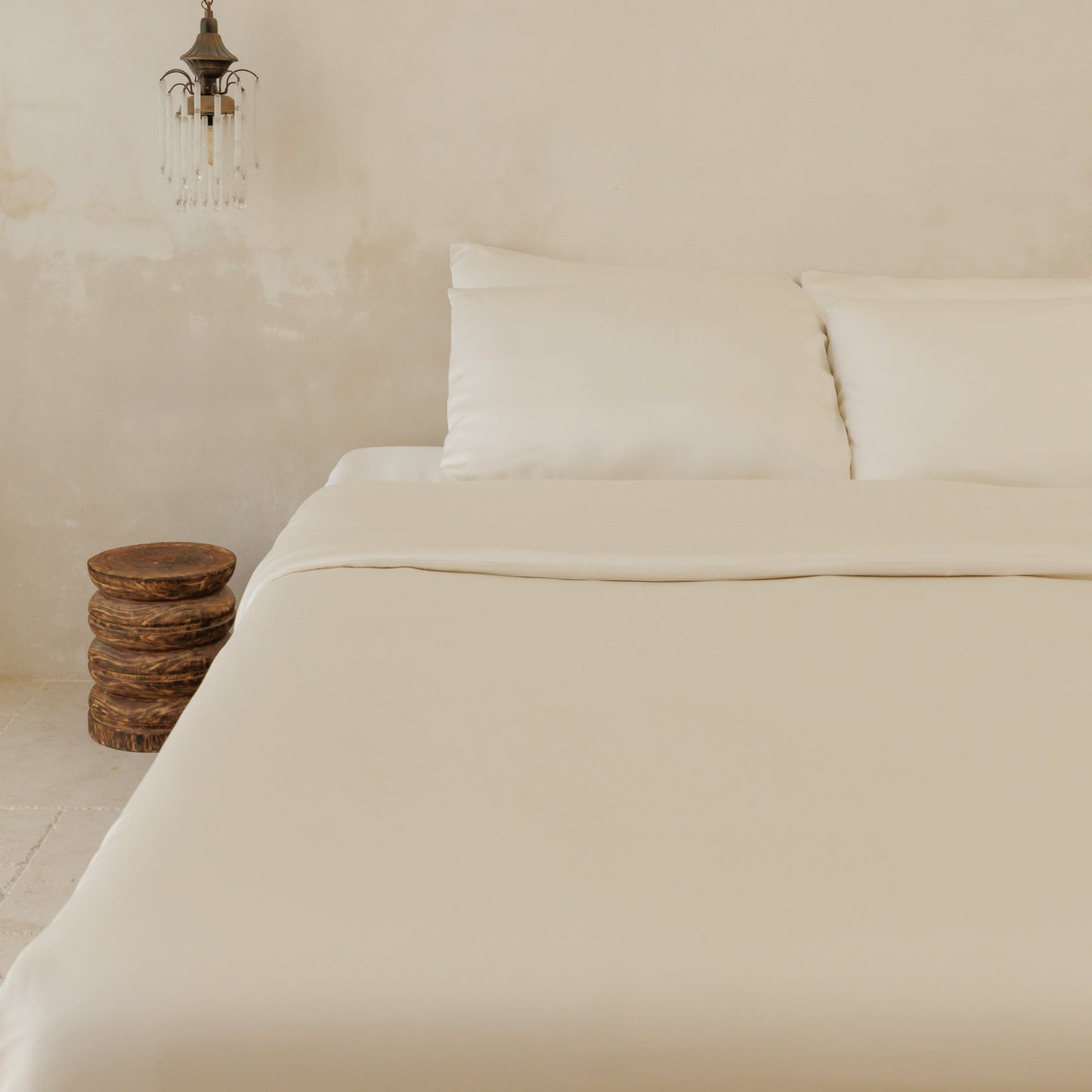 Stone bamboo sateen duvet cover on bed — soft breathable luxury bedding