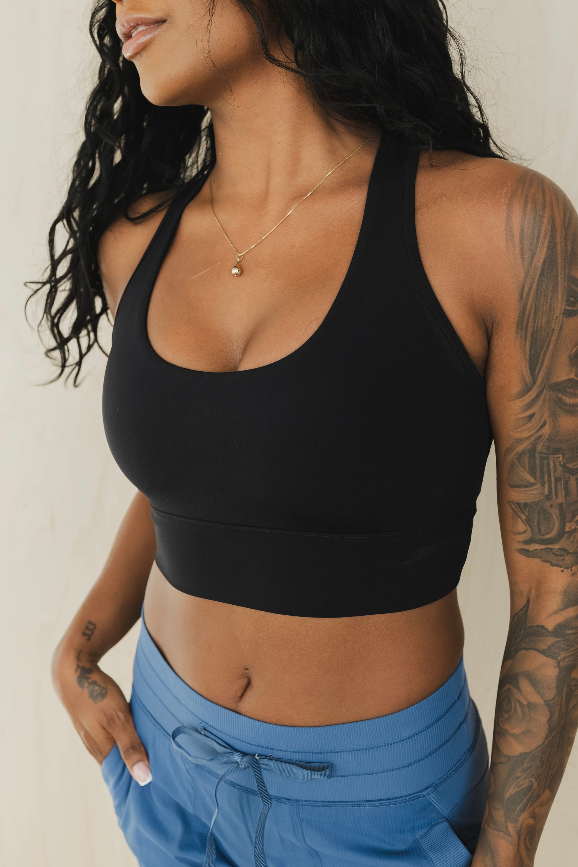 side view of racerback sports bra in black for yoga and fitness