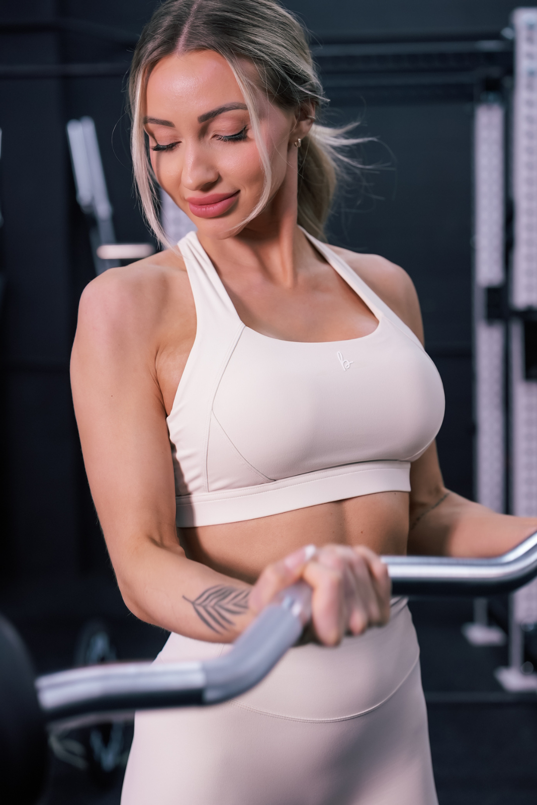 front view of a woman working out wearing a Fight or Flight high-support sports bra in sweet vanilla for yoga and fitness