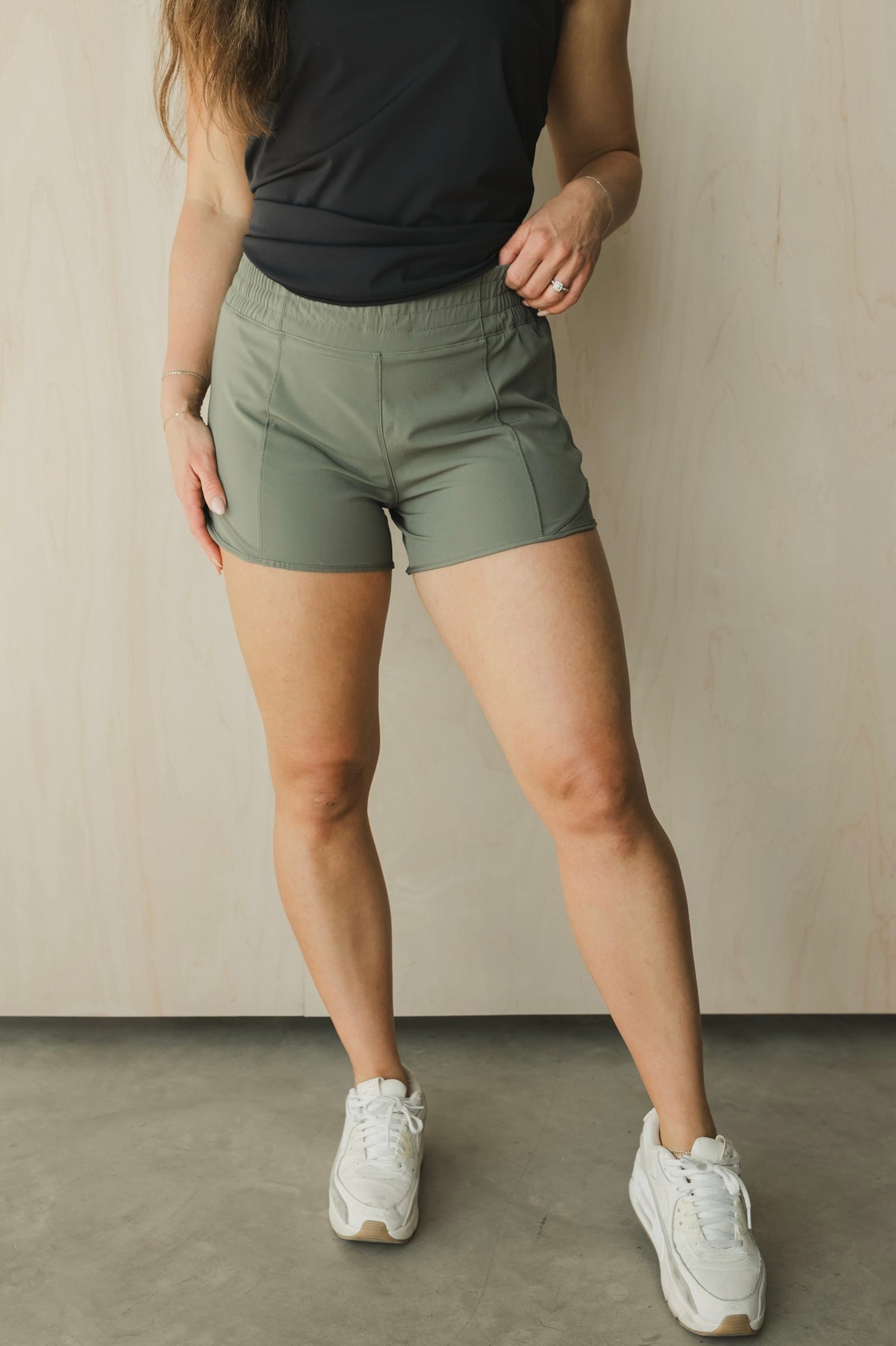front view of woman wearing Ready for It shorts in sage for workouts and casual wear