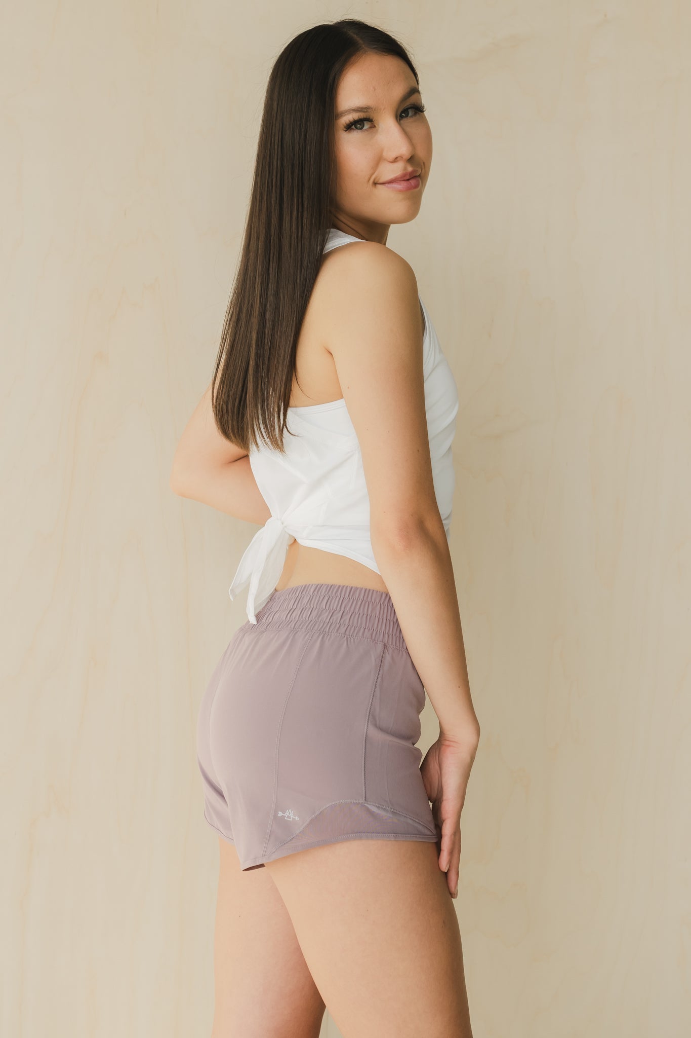 side view of woman wearing Ready for It shorts in amethyst grey for workouts and casual wea