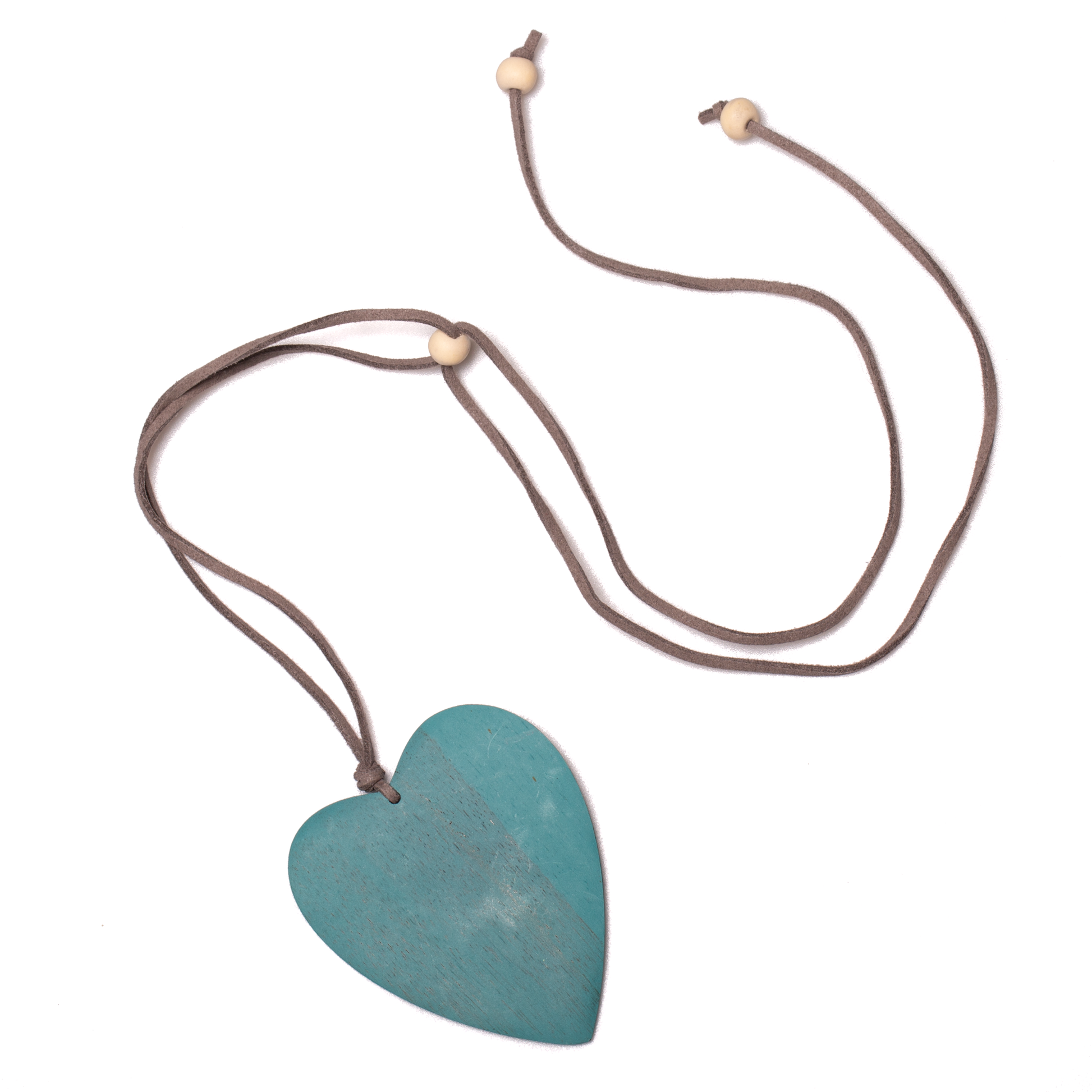 Tinted wood heart necklace in teal — handmade Bali jewelry on suede cord