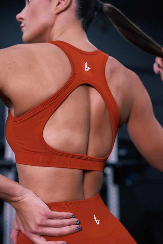 back view of silhouette seamless sports bra in vermillion red for yoga and fitness
