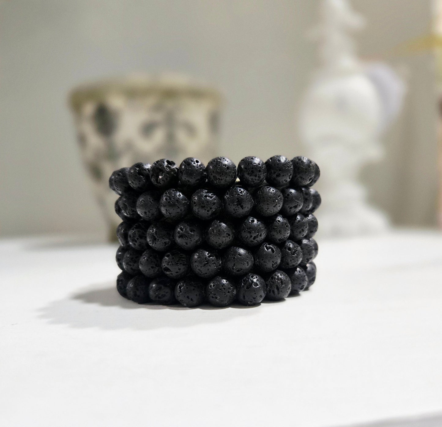 Lava bead bracelet close-up — porous black volcanic stone bracelet handcrafted in Canada