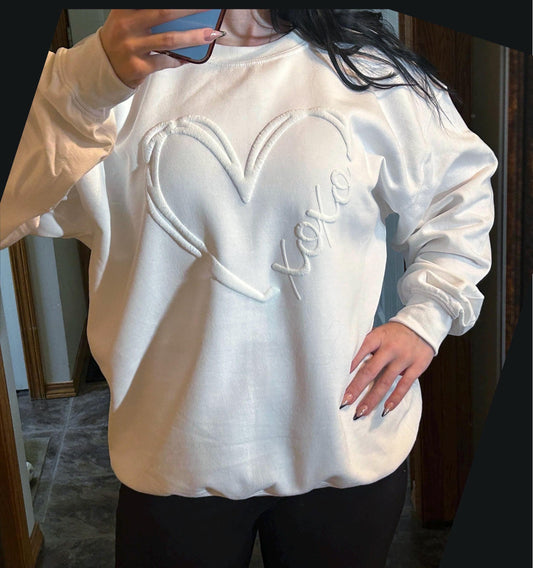 XOXO embossed heart sweatshirt in soft cozy fleece fabric for casual everyday wear