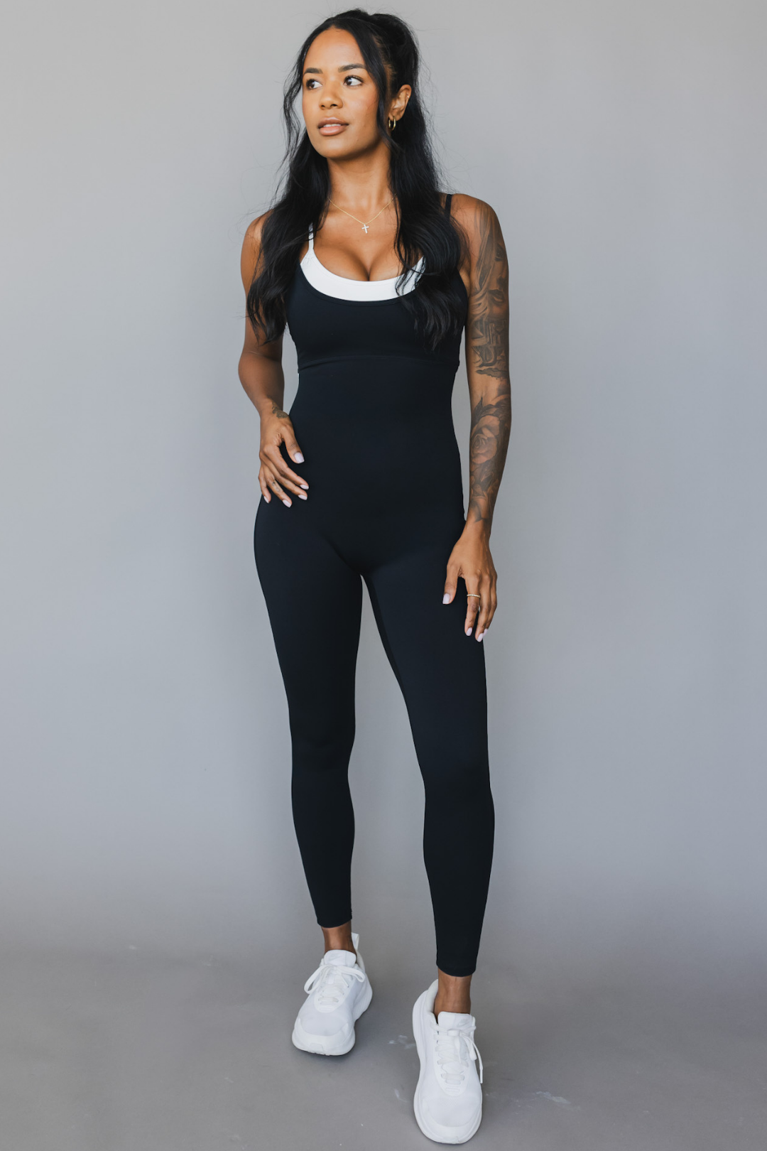 front view of a woman wearing tina bodysuit in black for yoga and studio wear