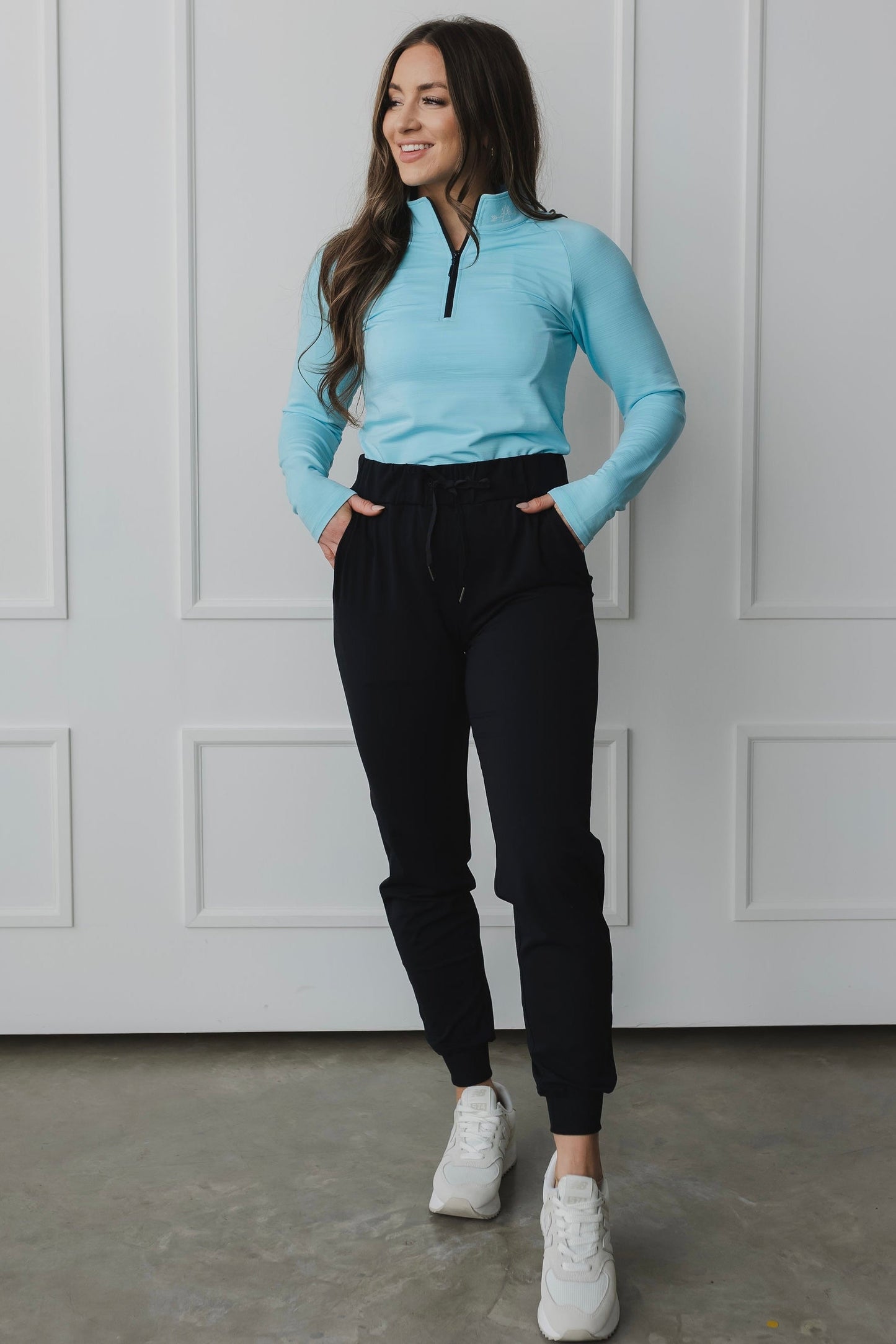 front view of a woman wearing cuffed ankle jogger in black for loungewear and casual athleisure 
