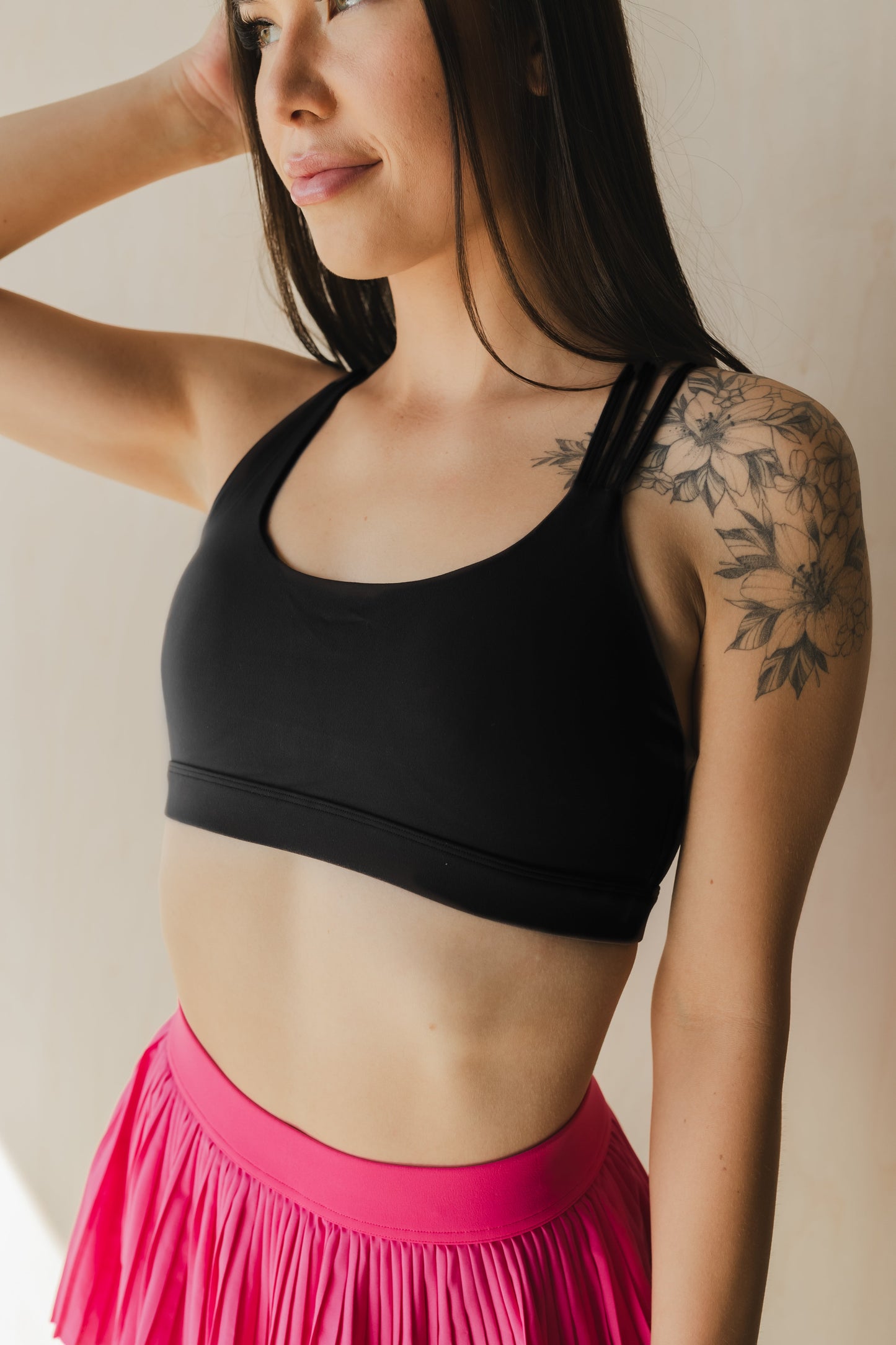 front view of a woman wearing S.F. V3 sports bra in lack for gym and high impact workouts