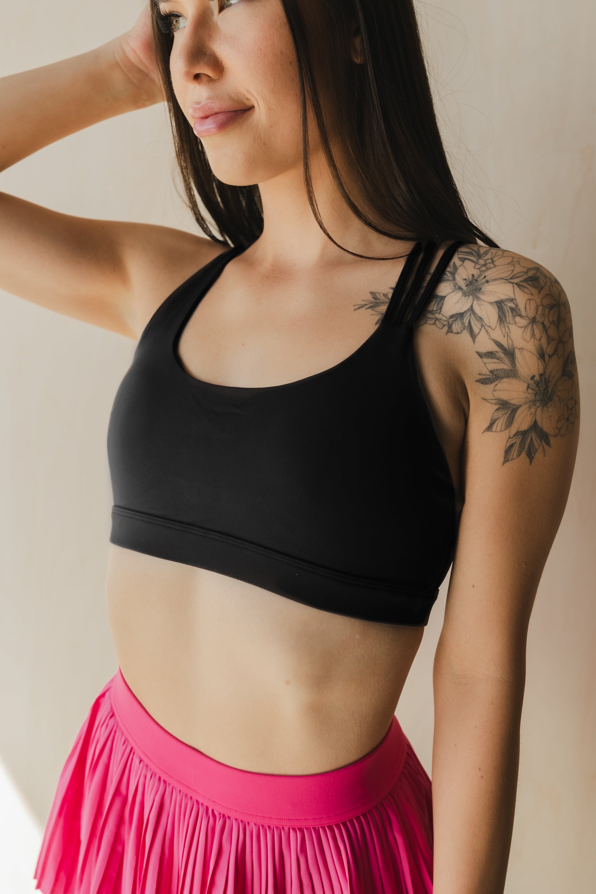 front view of a woman wearing S.F. V3 sports bra in lack for gym and high impact workouts