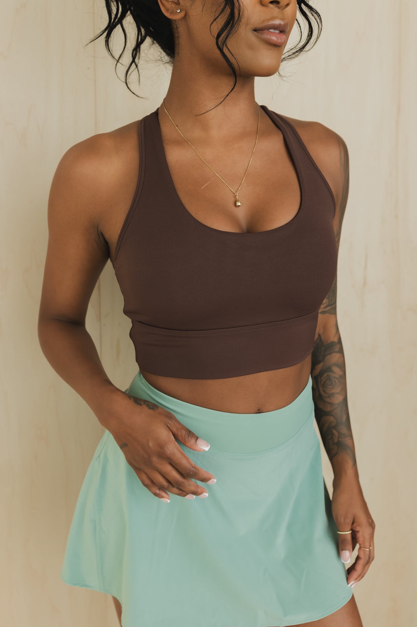 front view of racerback sports bra in americano brown for yoga and fitness