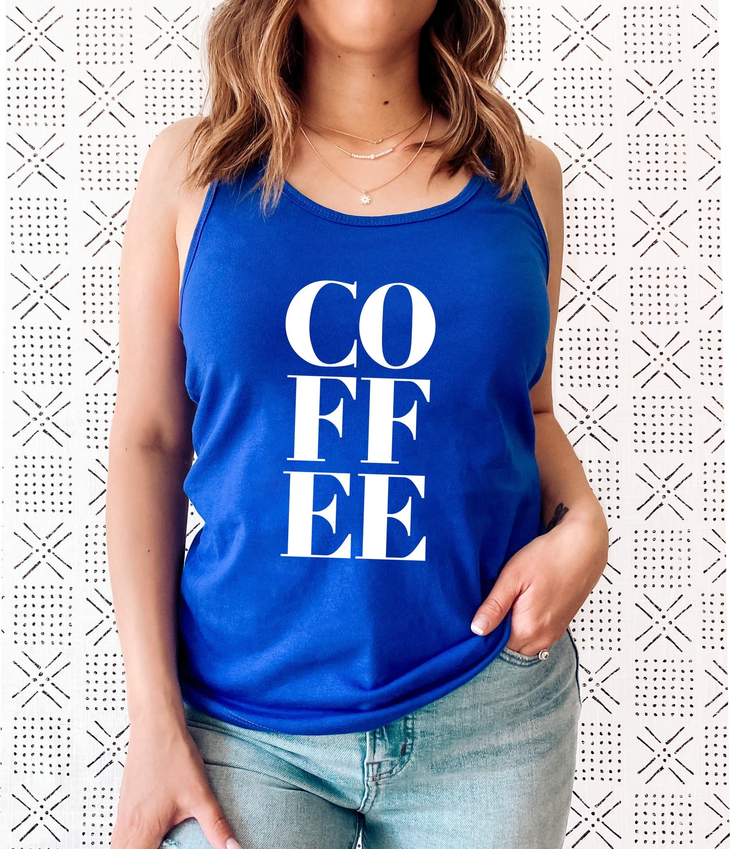 Coffee racerback tank top close-up showing soft fabric and graphic print detail in blue