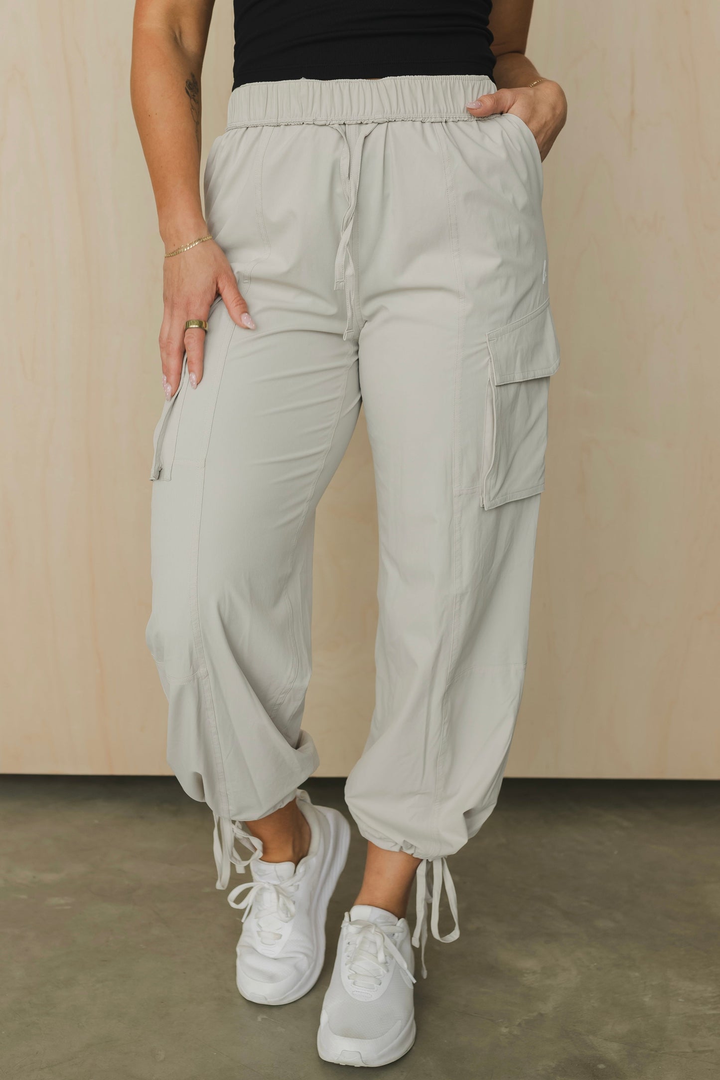front view of a woman wearing cargo pant in birch bark for outdoor wear and casual athleisure