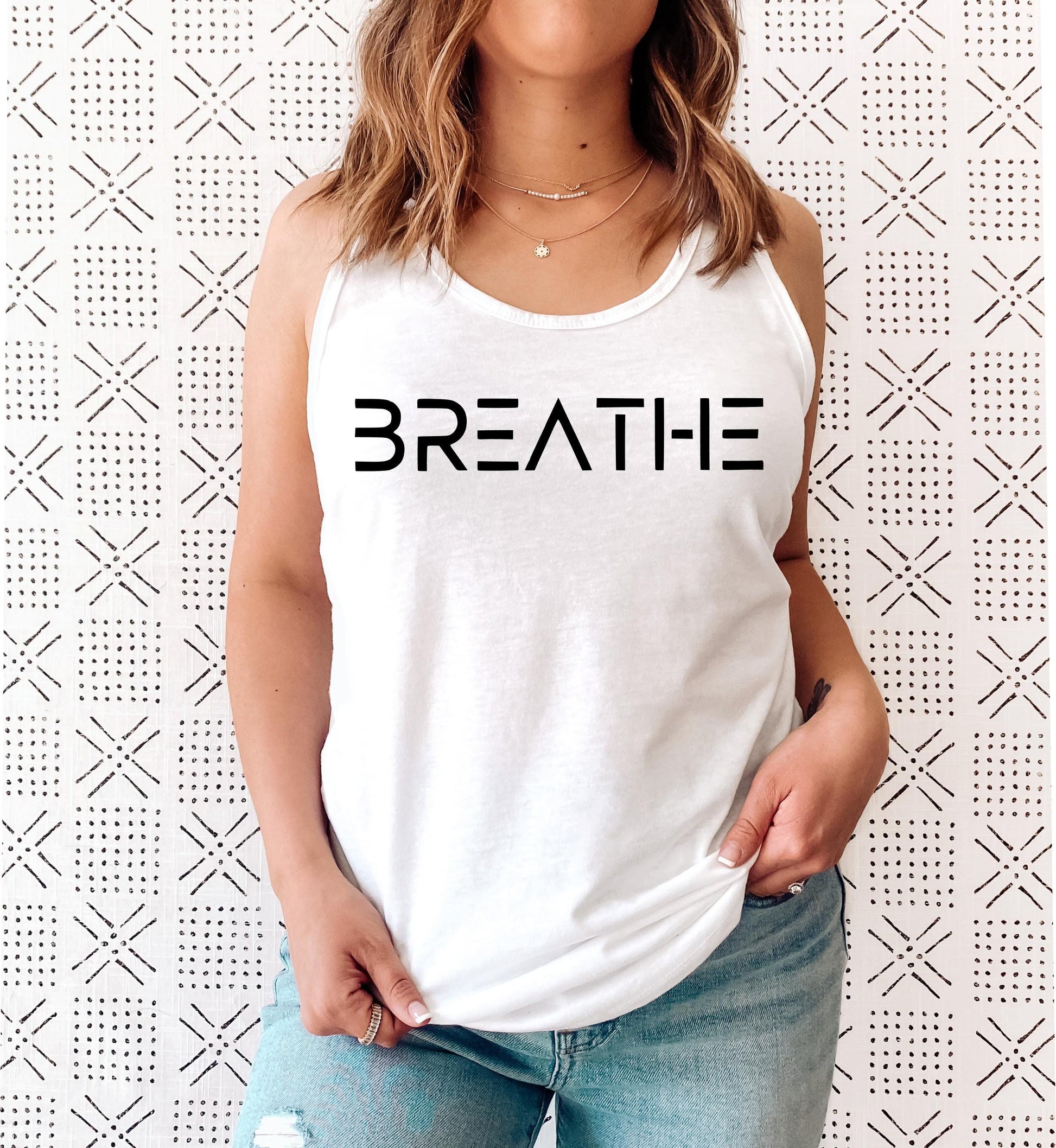 Calming and mindful "BREATHE" yoga tank top for present and grounded women in white