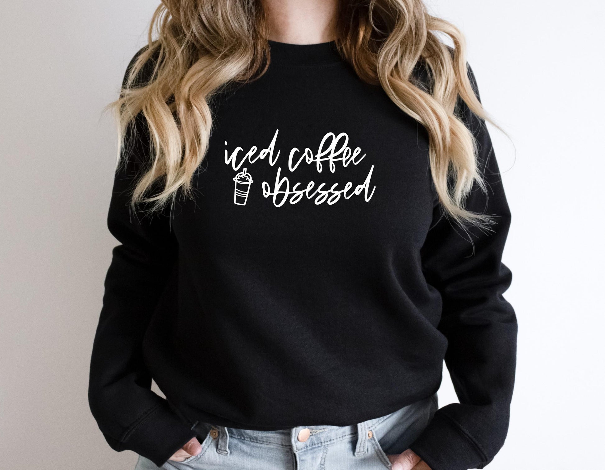 Women's funny iced coffee sweatshirt with bold and relatable graphic print in black