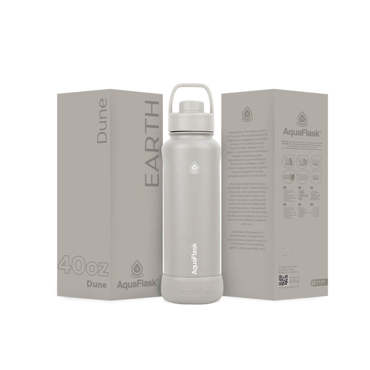 grey AquaFlask Earth 40oz bottle held outdoors in natural setting