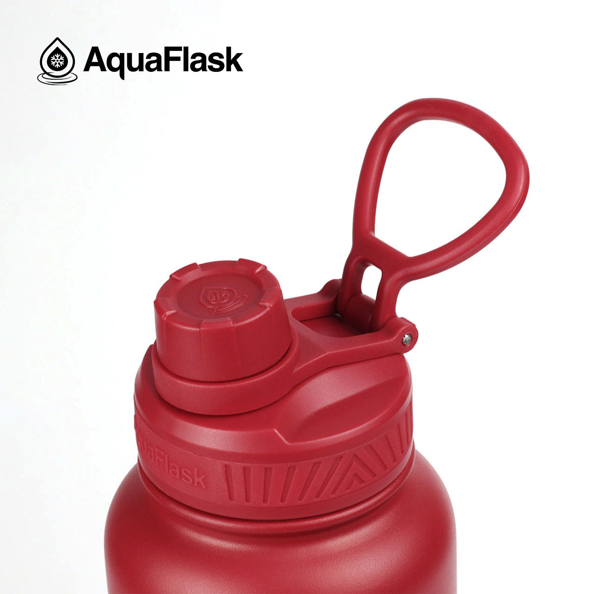 red lid AquaFlask Original 40oz in premium product flat lay photography