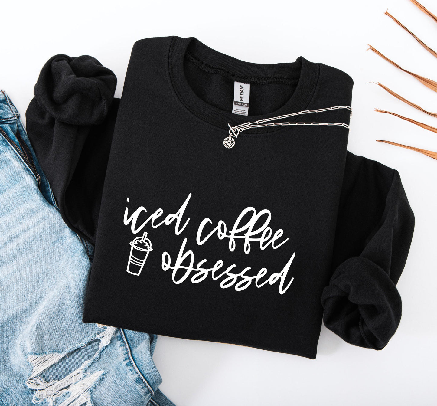 Women's funny iced coffee sweatshirt with bold and relatable graphic print on black