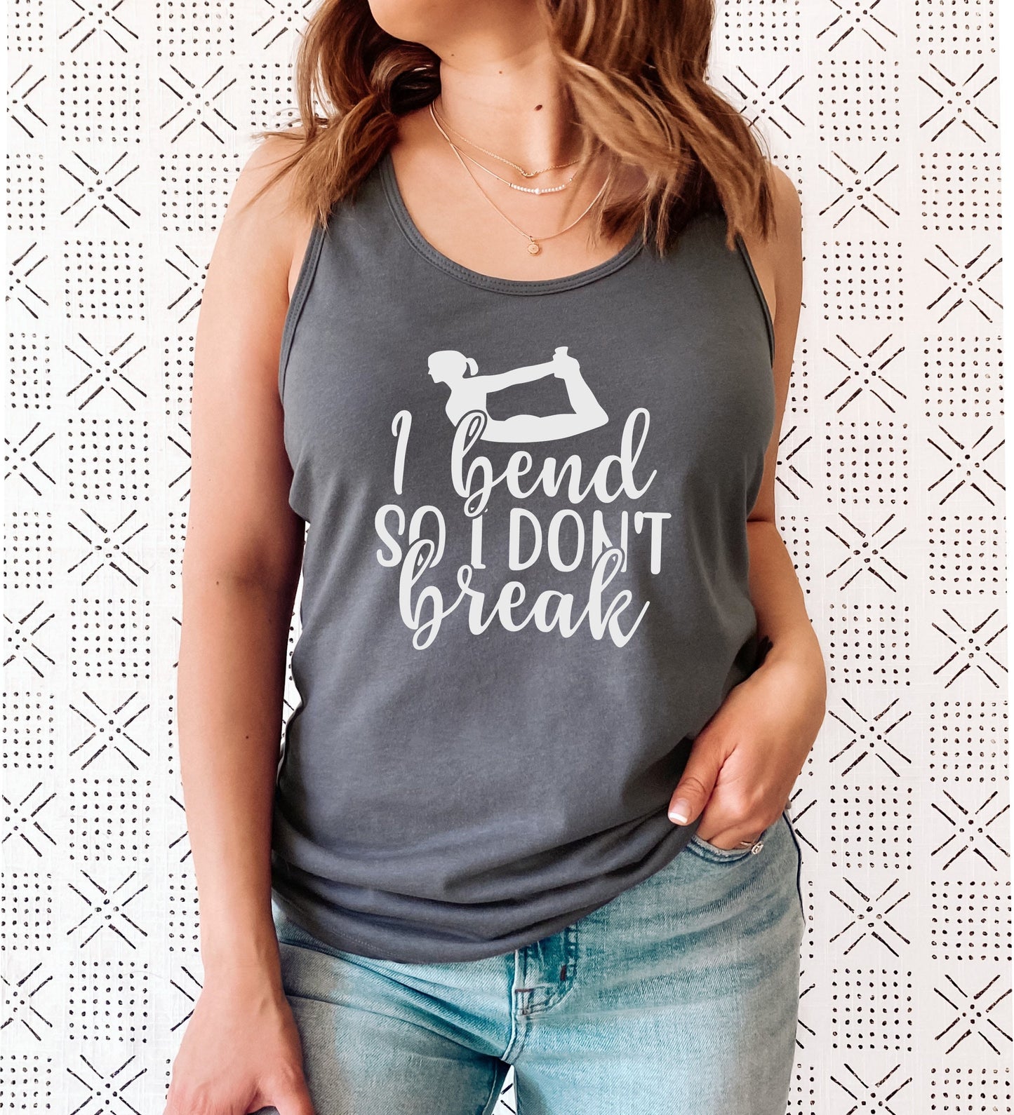 Women's yoga strength racerback tank with empowering and witty graphic print in dark grey