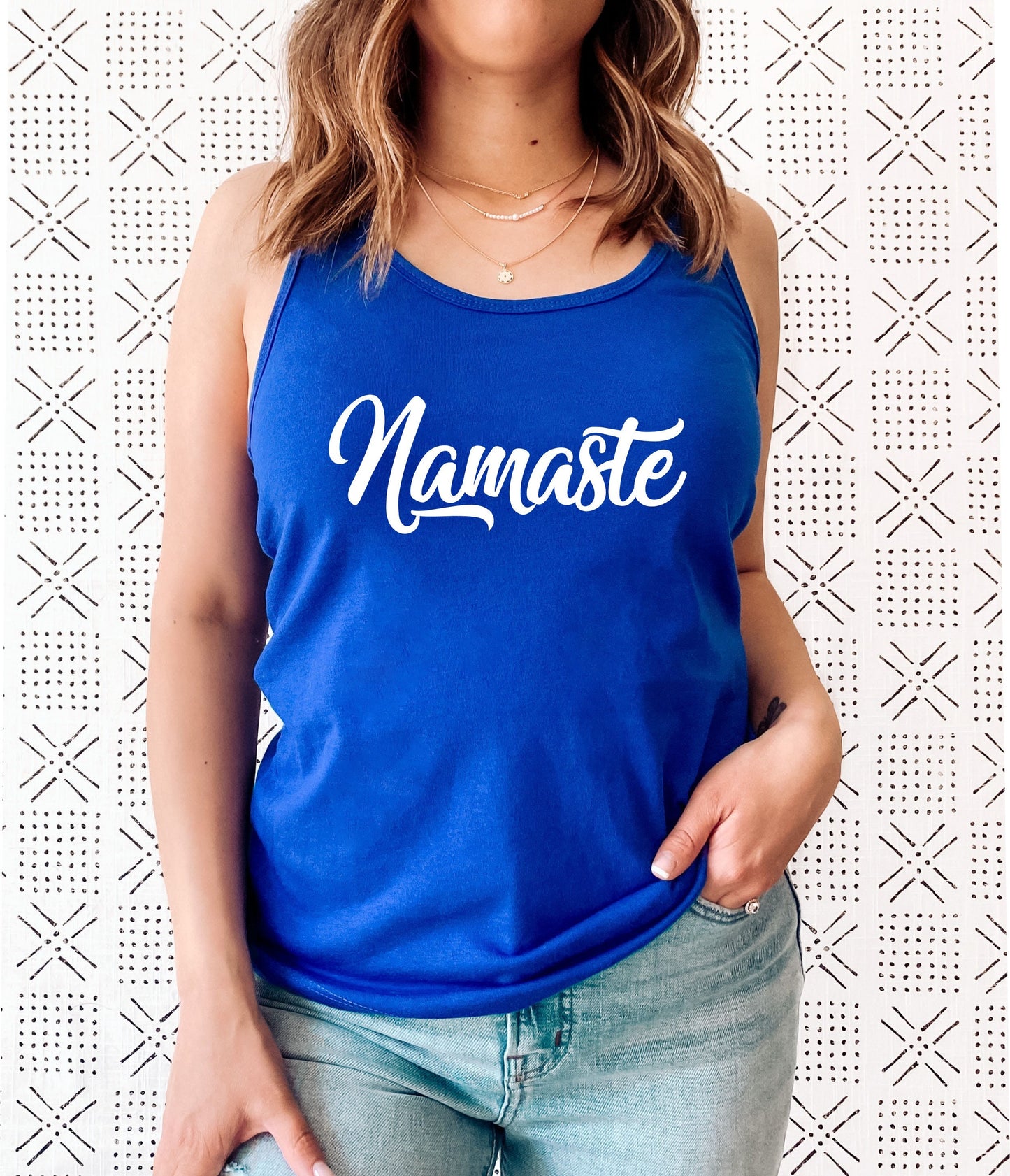 Namaste tank top close-up showing soft fabric and graphic print detail in blue
