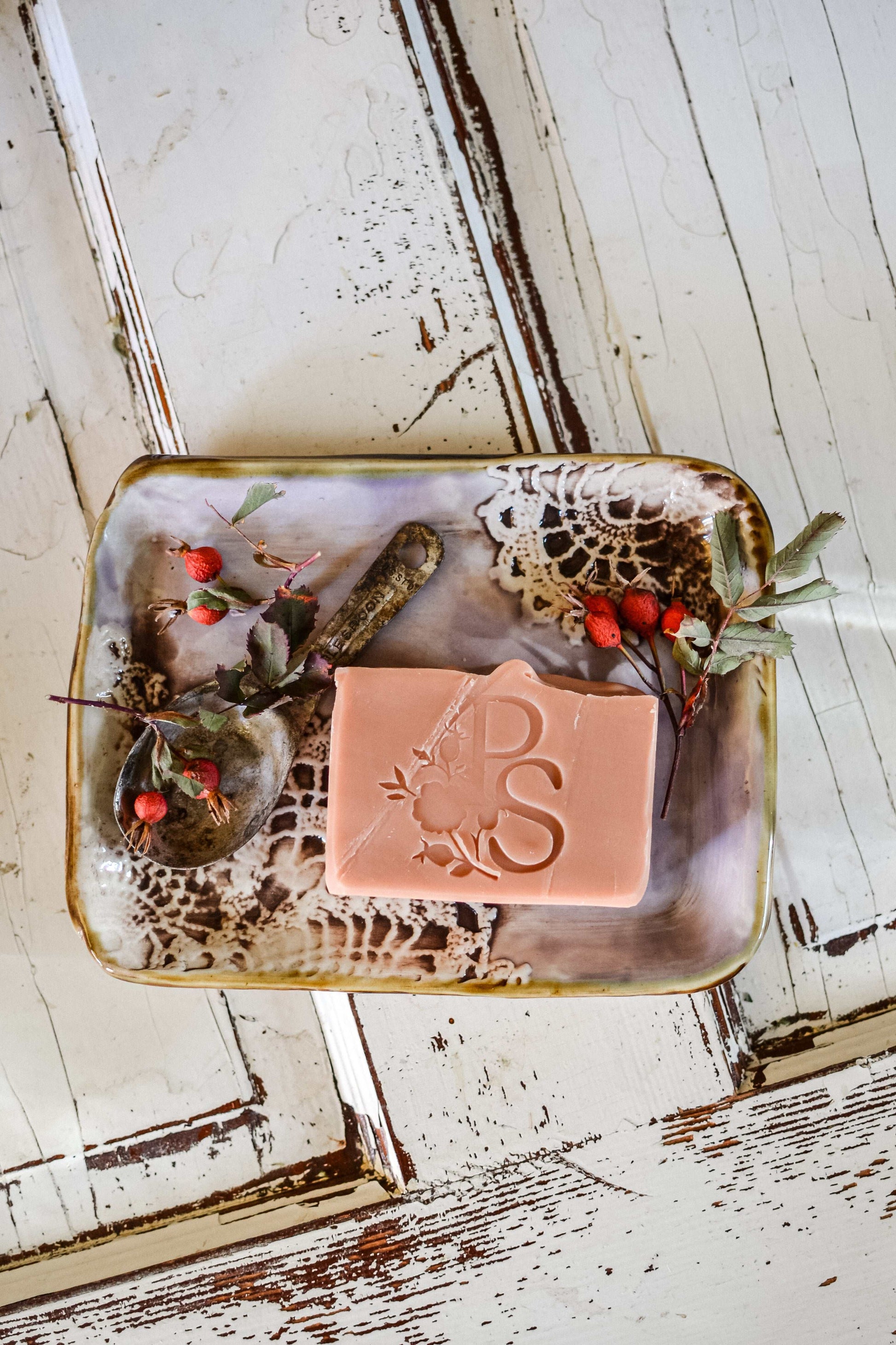 Natural rose clay and rose hip artisan soap close-up showing handcrafted detail