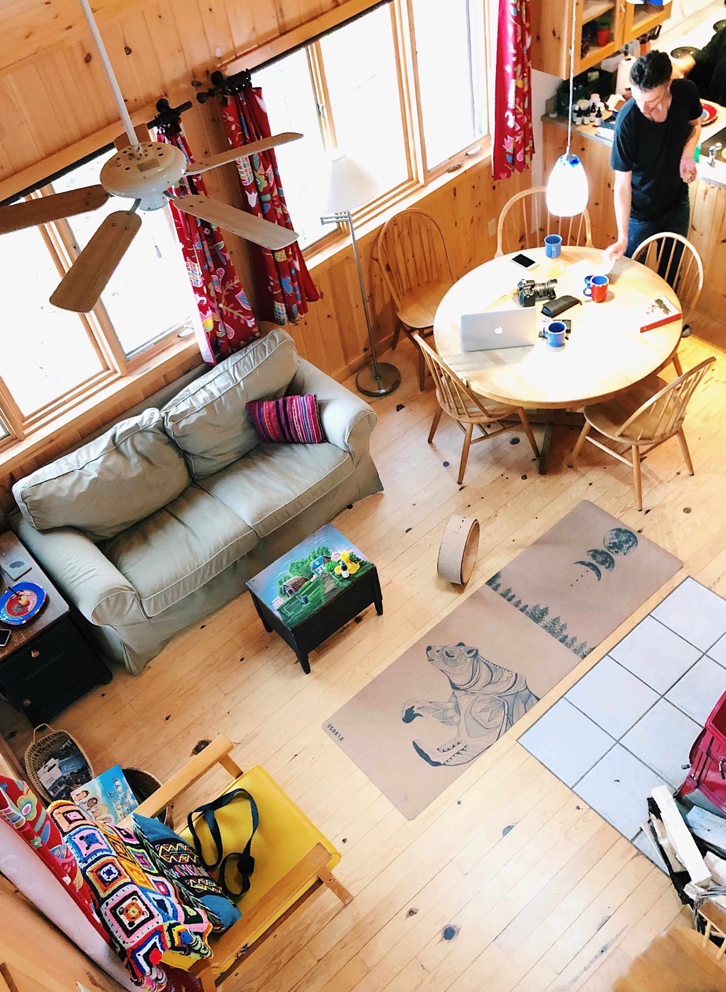 top view of a cork yoga mat with bear design in a cabin setting