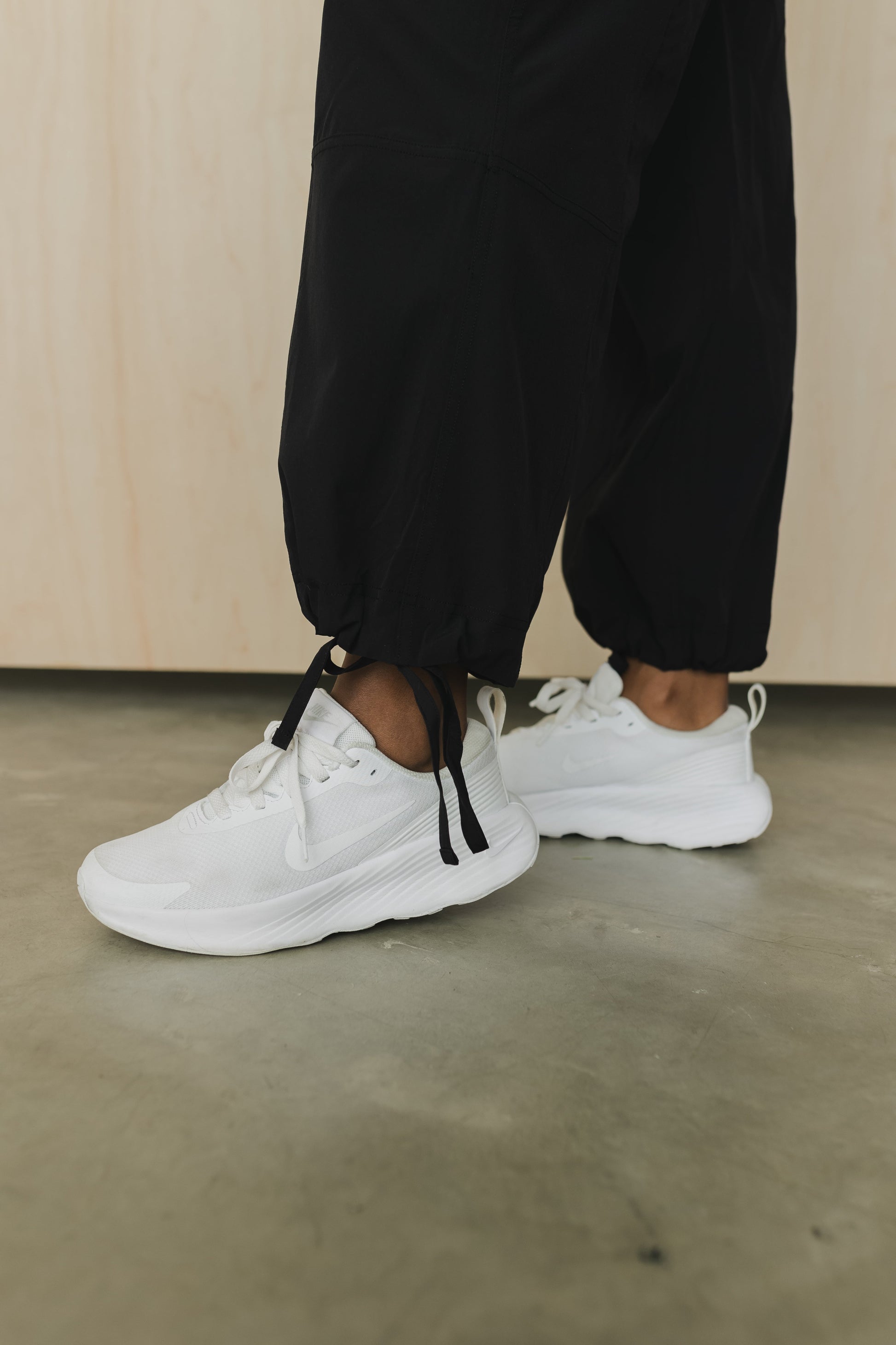 ankle view of a woman wearing cargo pant in black for streetwear and versatile everyday styling