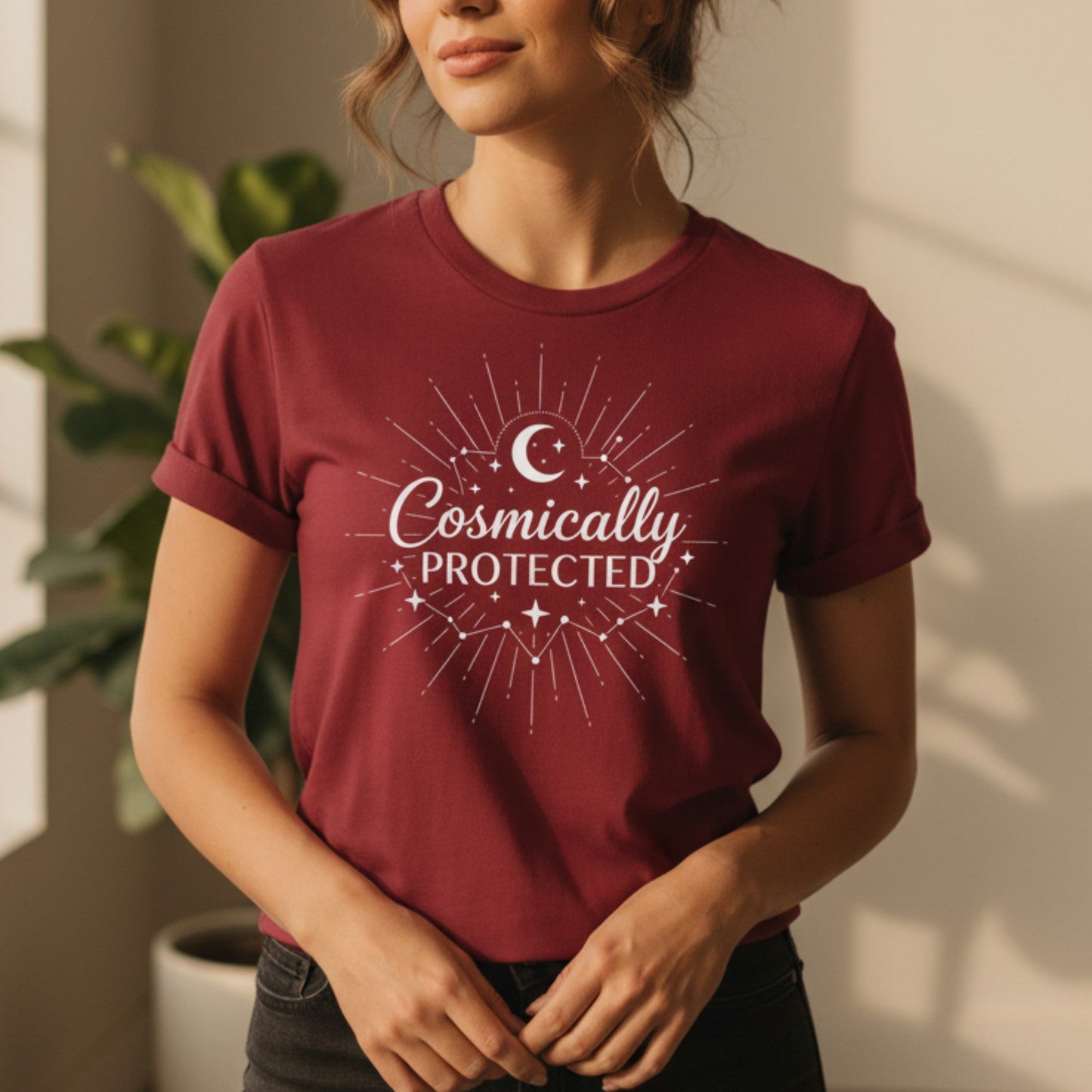 Cardinal red cosmically protected shirt with white moon and star print — bold spiritual statement tee for the woman who wears her faith and her fire at the same time