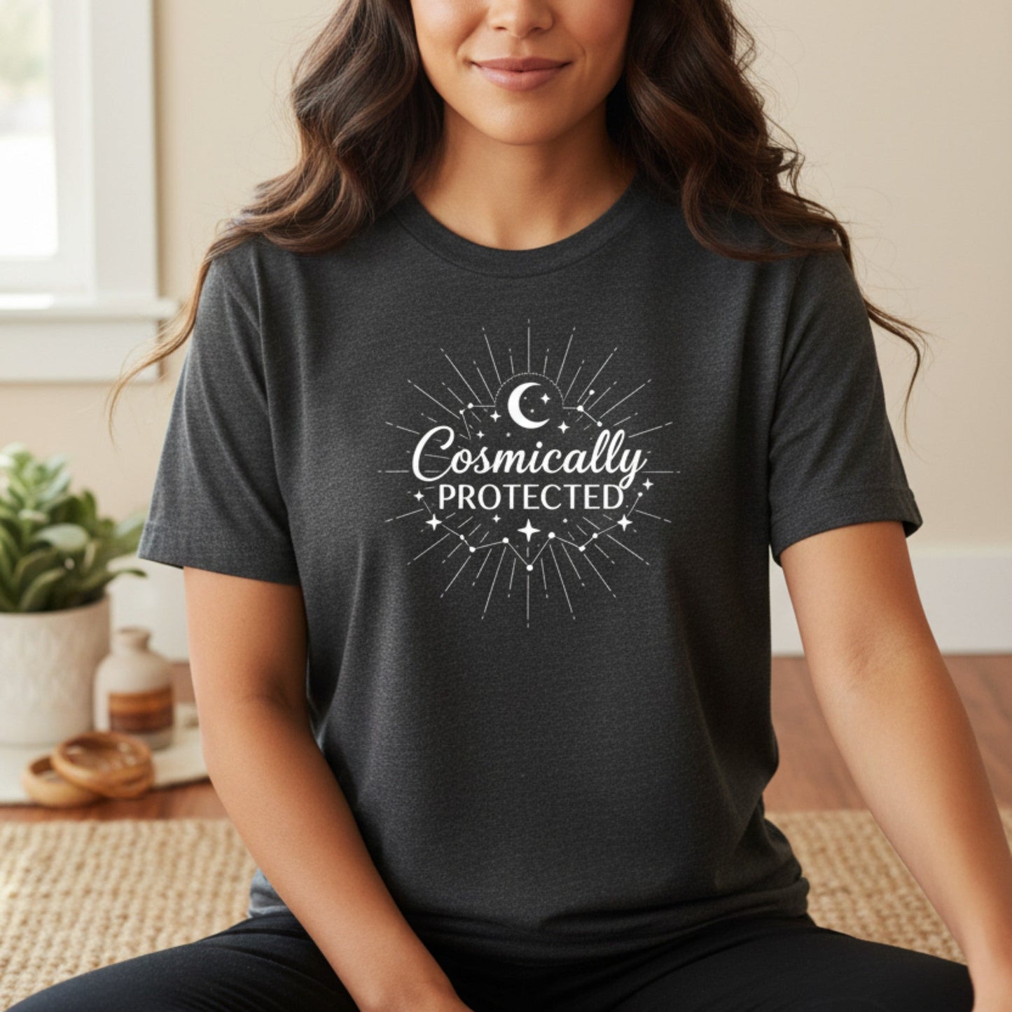 Dark heather gray celestial protection tee with white sunburst graphic — soft spiritual gift for the woman on a healing journey who moves through life guided and grounded