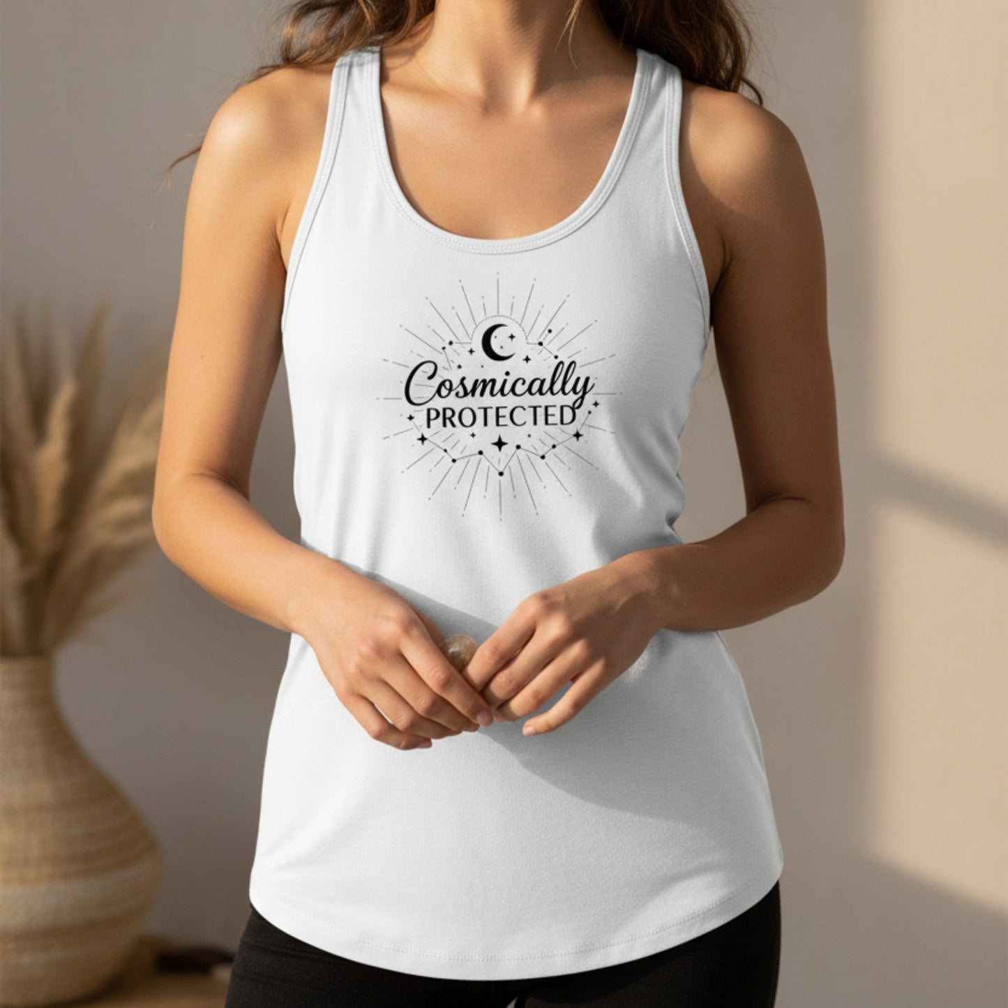  White cosmically protected tank top with black celestial starburst design — boho spiritual gift for the woman who trusts the universe to hold her