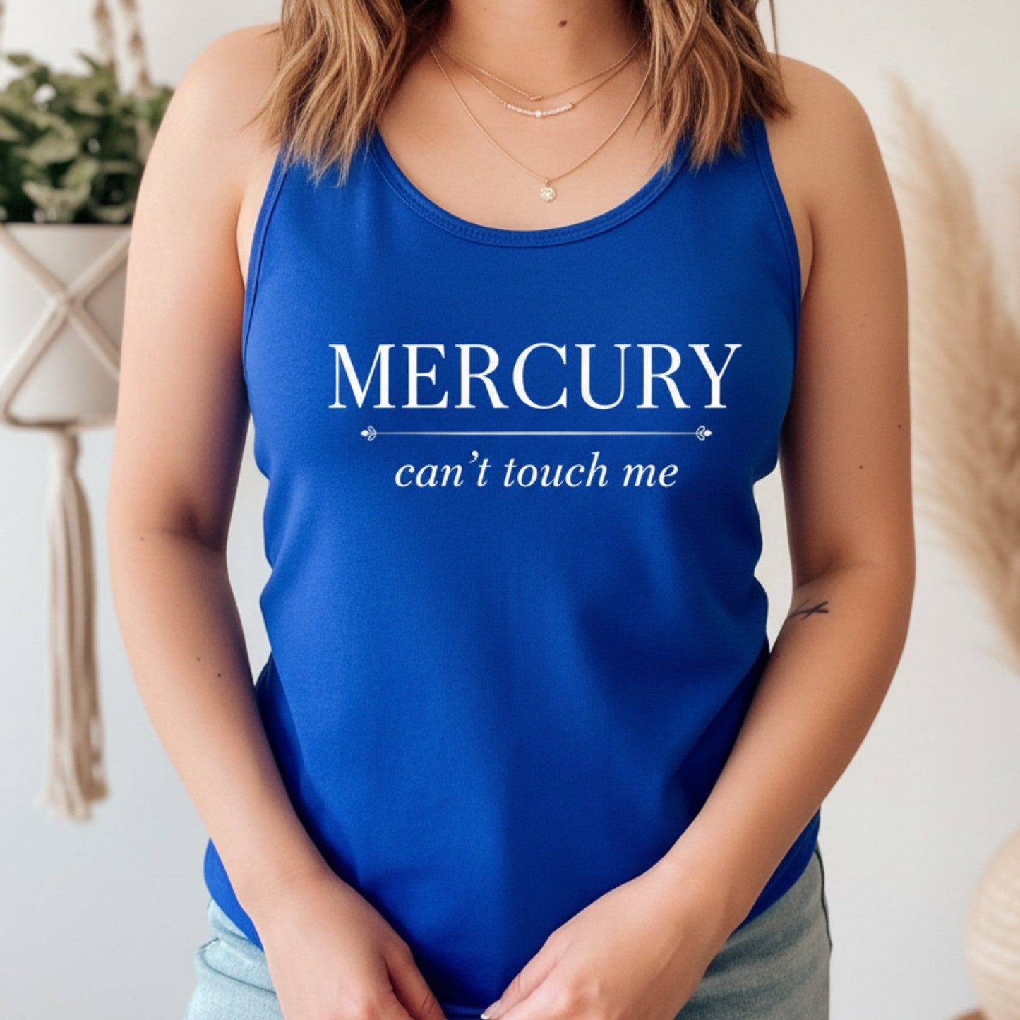 Royal blue Mercury Can't Touch Me racerback tank with white astrology print — vibrant celestial gift for the woman who stays grounded, guided, and completely unbothered by retrograde