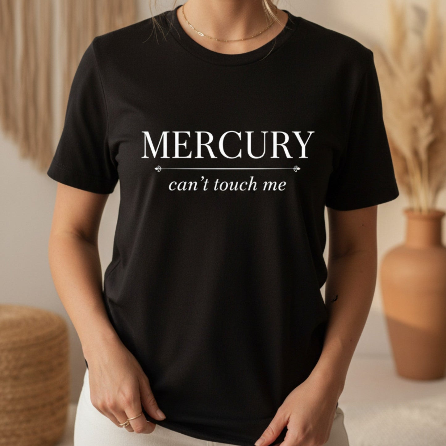Black Mercury Can't Touch Me t-shirt with white astrology typography — bold celestial gift for the woman who thrives in chaos and laughs at retrograde season